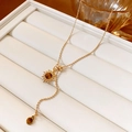 Detail of vintage gold bead necklace with sun pendant and brown tiger eye stones - 17# Gold Tiger Eye Flower Round Spliced Necklace