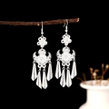 Silver bohemian long tassel earrings with vintage flower design hanging on a branch - Floral Cone Layered Tassel E4680-1