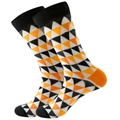 Detail of adult mid-calf socks with geometric triangles in black, white and orange - Black Orange White Triangles