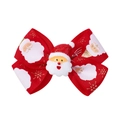 Close-up of a red Christmas bow hair clip featuring a Santa Claus motif and golden snowflakes - Red Santa Claus Style