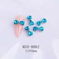 Bright blue bow-shaped nail art jewelry with crystals on light purple backdrop - Bright Blue Silver Base Bow (8082)