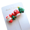 Detailed view of Christmas hair clips with resin Santa, bell, and tree on card - Style 3 Christmas Hair Clip