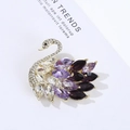 Elegant crystal swan brooch featuring gold metal and sparkling purple rhinestones - Purple Swan