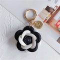 Elegant camellia leather keychain with black and white petals and gold coin charm - Black and White