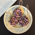 Handmade pink wool felt donut pendant with black spots and hemp rope loop detail - Pink Candy Donut