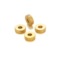 Macro view of four 6mm golden checkered wheel spacers for DIY jewelry craft - Plaid / Gold