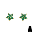 Detail of star-shaped stud earrings with gold plating and seven green zirconia stones - A-Star (Green)