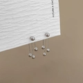 Silver triple ball tassel earrings with a mirror-polished finish on a display board - Silver Ball Chain Tassel