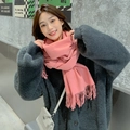 Pink cashmere-feel winter scarf with long tassels worn with a gray knit jacket - Pink Heather