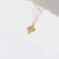 Golden cactus necklace with green zircon stones on minimalist white background - Green Zircon Cactus