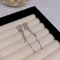 Elegant silver tassel bow earrings featuring pink heart crystals in a jewelry box - Pink Heart Crystal Tassel (HSLE6099 Silver)