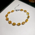 Elegant silver bracelet featuring oval-cut yellow zircons and an adjustable lobster clasp - Silver-Yellow