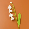 Handmade knitted Lily of the Valley branch with white crochet flowers and green leaves - White