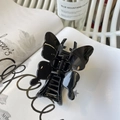 Elegante pinza para el pelo de mariposa negra brillante para mujer en fondo estilo nórdico - Mariposa Con Hebilla De Color Negro Brillante (aproximadamente 11 Cm)