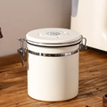 White stainless steel airtight coffee canister with date tracker on a wooden table - 1.2L / White