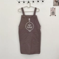 Brown cotton linen apron featuring 'Eat My Food' print and large front pocket - EAT Grey