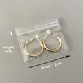Golden round metal earrings in transparent PVC sealer bag, size 7.2cm by 6cm - 30 Micron 7.2x6cm Resealable / 100 Pcs/Pack