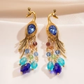 Orecchini vintage a pavone dorati con gemma blu e perline di cristallo colorate - Oro