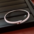 Macro shot of silver plated cross buckle bracelet with pavé cubic zirconia setting - Silver