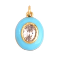 Oval gold pendant with vibrant blue enamel edge and clear faceted gemstone center - Oval Lake Blue