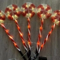 Solar Christmas candy cane stake lights with red white spiral pattern for yard - Lollipop
