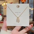 18K gold plated clover necklace with white opal stone and zircon on display card - X004 Gold Shell Clover
