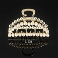 Macro shot of 7.7cm gold hair claw clip featuring rows of elegant white pearls - Full Pearl Large Crescent 7.7CM Claw Clip
