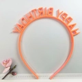 Close-up of orange plastic headband featuring Happy Birthday lettering design - HP-Colorful Orange