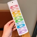Close-up of 10 colorful matte drop-shaped and star hair clips for kids on display card - 10Pcs Colorful Oval Shape Clips Set