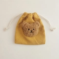Detail of yellow corduroy drawstring bag with plush bear head and soft texture - Ginger (Coffee Bear)