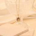 Elegant gold oval sunflower necklace with brown crystal pendant and clear rhinestones - Brown