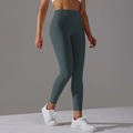 Dettaglio dei leggings da yoga senza cuciture a vita alta verde grigio scuro modellanti - XS / Verde Bosco