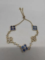 Adjustable gold bracelet with blue clover charms and white cubic zirconia accents - Blue