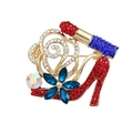 Gold heel and lipstick brooch with blue rhinestone flower and colorful crystal accents - High Heels & Lipstick