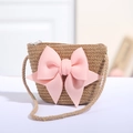 Detail der gewebten Stroh-Minitasche mit rosa Schleife und Seilschultergurt - Braun mit 3D-Rosa-Schleife