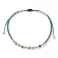 Handmade woven bracelet featuring green cylindrical beads and faceted natural stones - Green