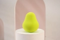 Vibrant lemon yellow teardrop makeup sponge blender on white display stand - Lemon Yellow Waterdrop