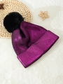 Detail of purple metallic knit beanie with large black faux fur pom pom and cuffed design - One Size / Rose Red