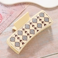 Beige rectangle hair claw with bohemian geometric prints on a vintage wood background - Beige Bohemian Geometric