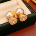 Detailed close-up of champagne pearl earrings with gold-plated zircon settings - Champagne Gold (Silver Pin)