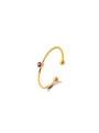 Macro detail of gold-plated ring featuring a bezel-set purple zircon and rounded ends - Pink