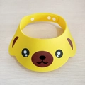 Detail of adjustable yellow baby shower cap with ear flaps and cute puppy face design - Yellow Dog (Bagged)