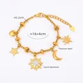 Detail showing 18k gold plated titanium steel bracelet with sun and moon charms - Celestial Theme / Gold
