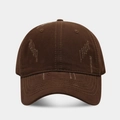 Detailed macro view of distressed cotton twill fabric on dark brown baseball cap - Coffee