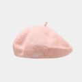 Detail of light pink wool beret featuring 1987 embroidery and a small top stem - One Size(Adjustable) / Pink