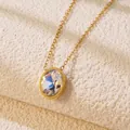 Close-up of elegant gold necklace featuring a faceted oval clear crystal pendant on stone - Clear Oval Necklace (BD022-white)