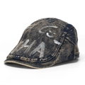 Detail of washed denim newsboy cap with white HA graffiti and metal adjustment buckle - Style E-Washed Indigo Blue (HA)