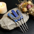 Detailed view of silver crescent moon hair pins with blue lapis lazuli on grey rock - Lapis Lazuli
