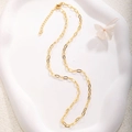 Detail of gold-plated paperclip chain necklace with lobster clasp on a white wavy tray - A0152 Small Paperclip Chain