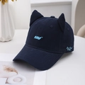 Dark blue baseball cap with cat ears and blue embroidery on a white decorative table - Navy Blue